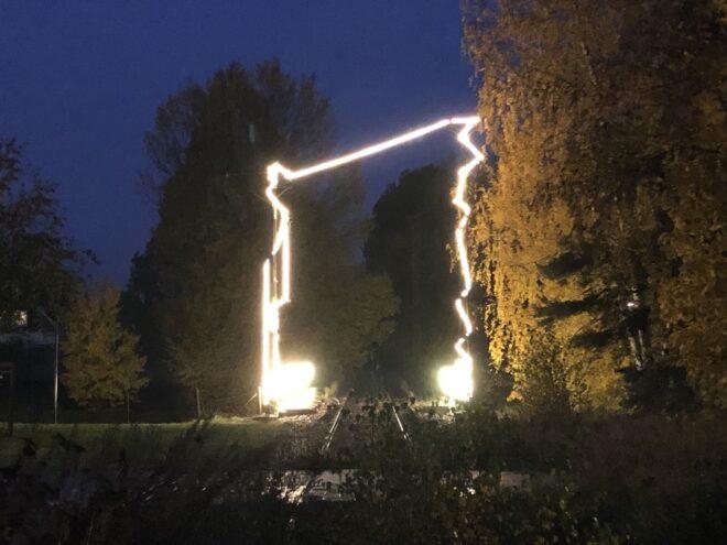 light art installation over old train tracks