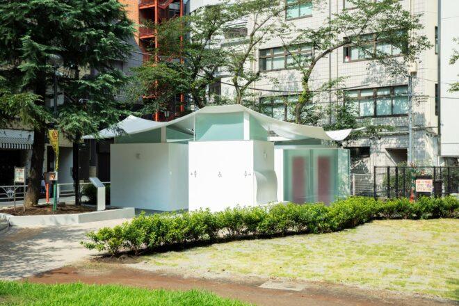white public toilet building with undulating roof