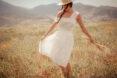 person twirling in white dress