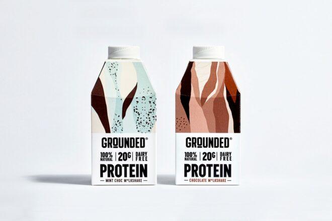 chocolate protein shake and mint chocolate protein shake on white background