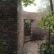 curved brick wall with large opening