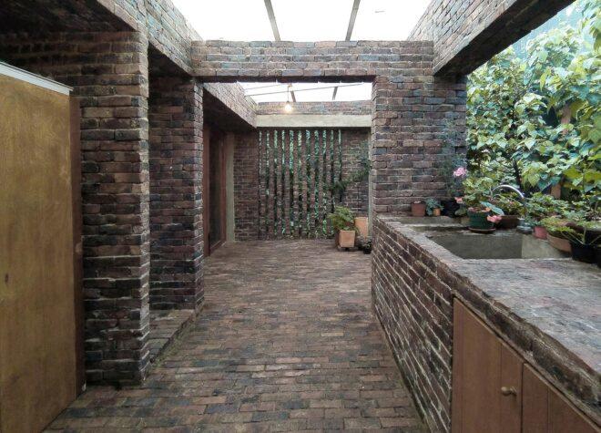 outdoor kitchen built into a brick patio