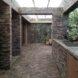 outdoor kitchen built into a brick patio