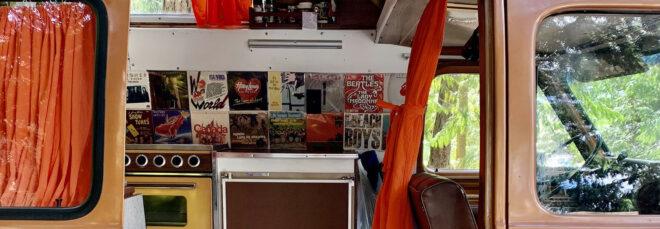 a kitchen area with album covers as wall decorations.