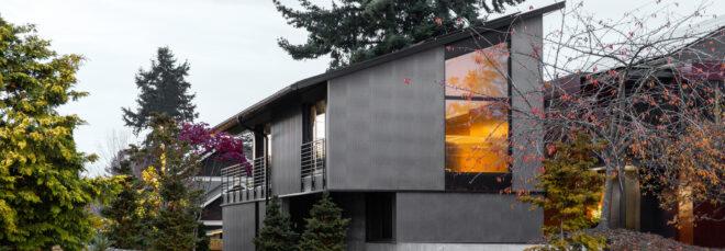 two-story gray home with slanted roof
