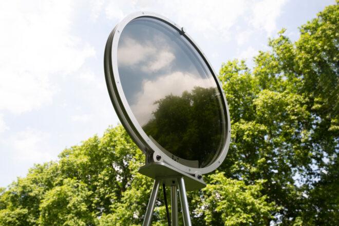 silver circle-shaped device with dark center
