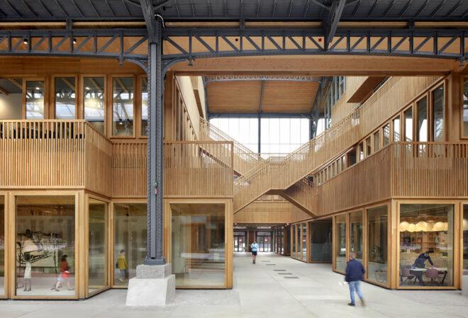 Wood staircases crossing through a timber shopping center.