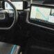digital screens with maps in an electric van