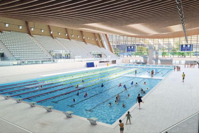 a large pool area with stadium seating.