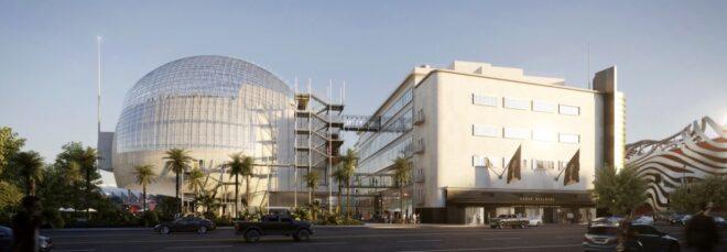 spherical building connected to large white building