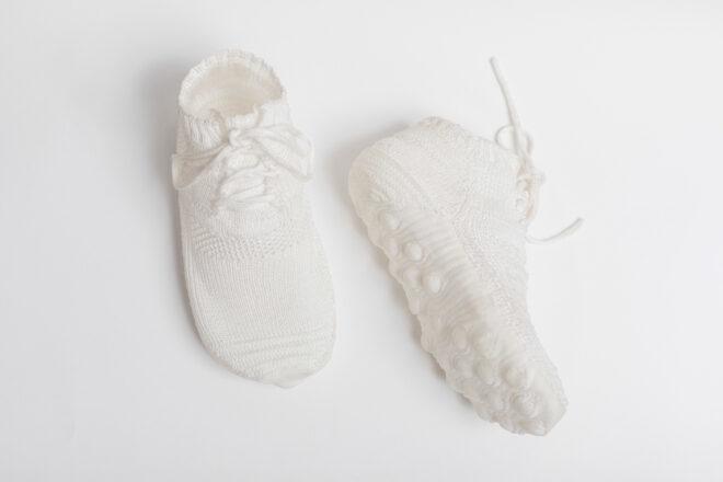 two white sneakers on white background