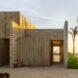 Exterior walls of the home made up of wood and other natural materials.