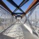 close-up of perforated aluminum guardrails on a bridge