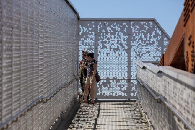 ramp enclosed with perforated aluminum guardrails