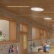 rendering of school hallway with hooks for bookbags and coats