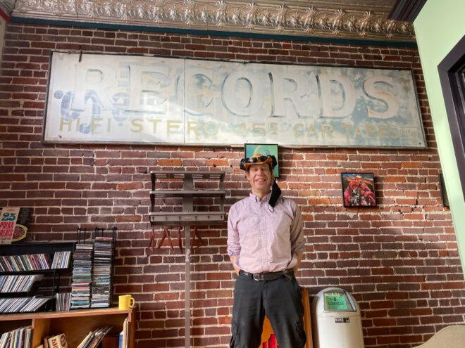 Zac Smith standing near brick wall