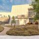 rendering of walkways and plants near large tan building