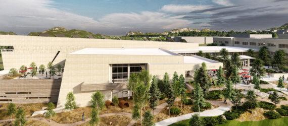 aerial rendering of large tan building with solar panels