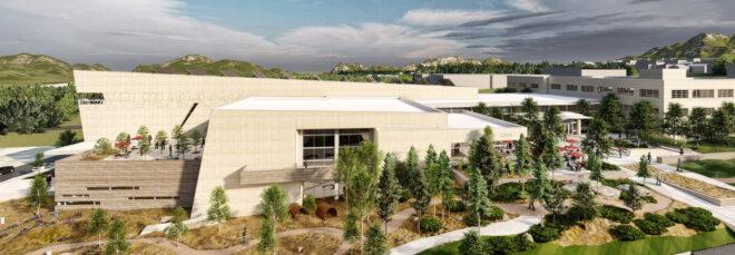 aerial rendering of large tan building with solar panels