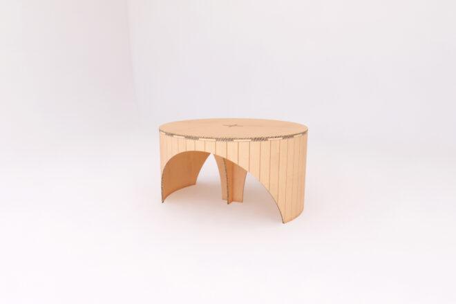round cardboard coffee table on white background