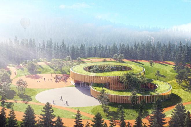 aerial view of round, cantilevered wood building with green roofs