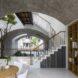 built-in wood bookcase near white staircase