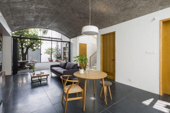 small wood dining table near gray sofa