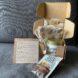 pumpkin spice candle and sunflower seed butter inside cardboard box