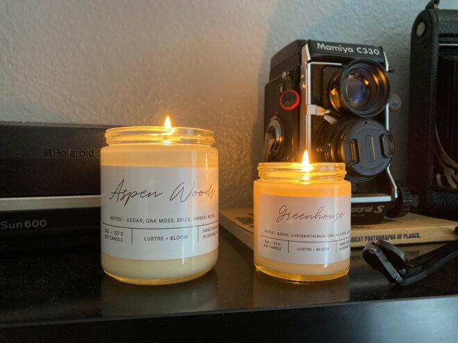 two candles on fireplace mantel