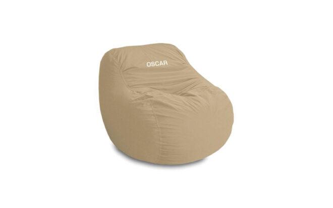 tan bean bag chair with the name "Oscar" embroidered in it