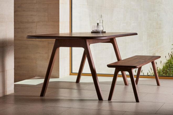dark wood dining table with long dark wood bench