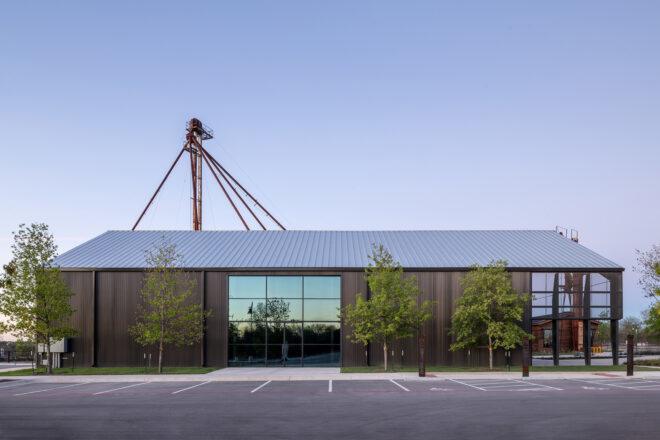 long black building with white gabled roof