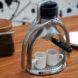 two espresso cups under spout of metal manual espresso machine