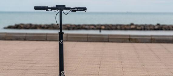 black e-scooter near a beach