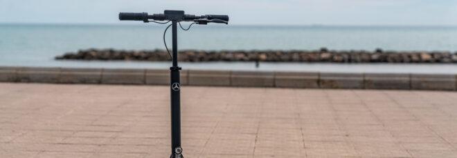 black e-scooter near a beach