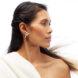 person wearing silver snake earrings