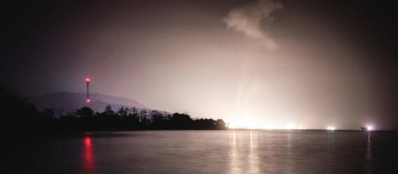 lights shining and casting a glow on a night sky
