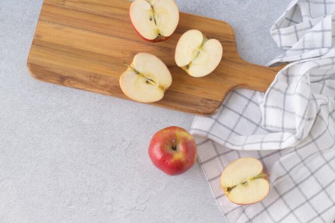cut apples on wood board