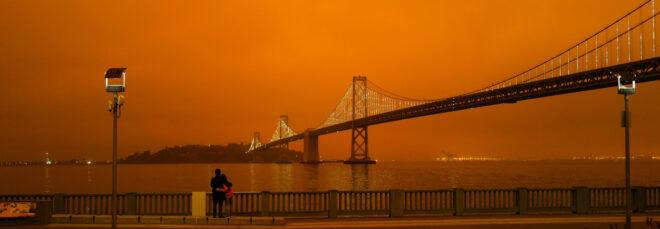 San Francisco bridge under orange skies caused by wildfires