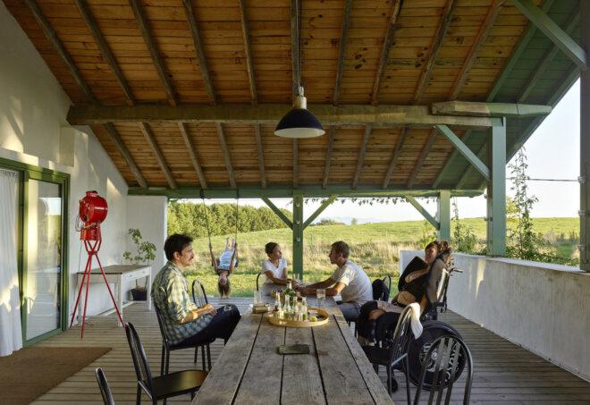 An outdoor dining area where people are sitting together.