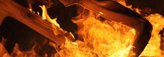 Plastic melting and surrounded by flames.