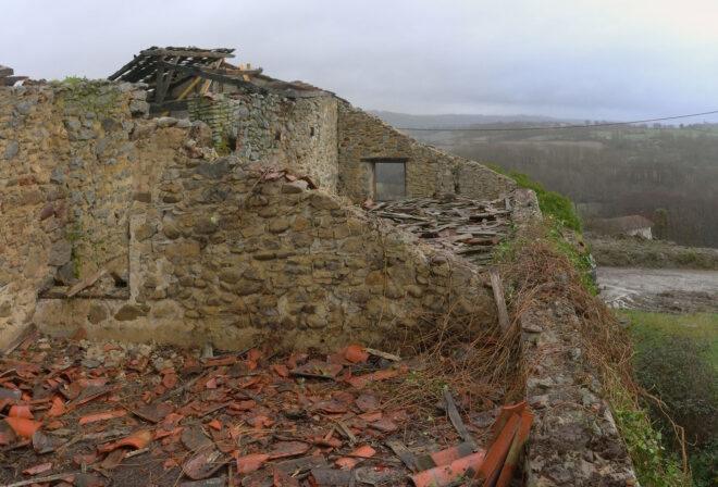 The rooftop of a crumbling old farmhouse.