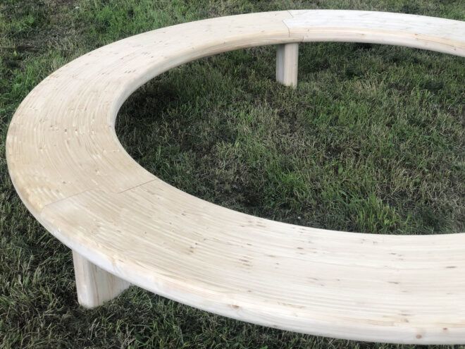 One half of the wood Circula bench.