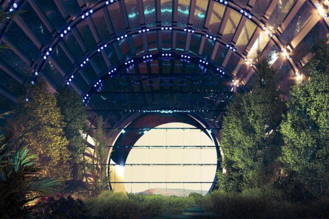 A room full of plants, with a large circular opening looking outside.
