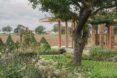 lush garden near glass home