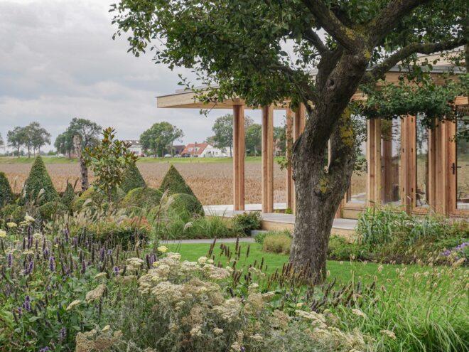 lush garden near glass home