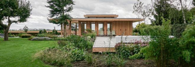 long timber building with glass walls