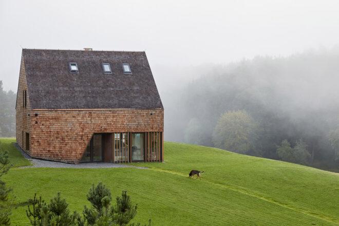 large cedar home with gabled roof