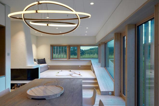 minimalist interior with round light and large windows