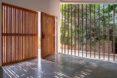 slatted wood doors opening to an entryway